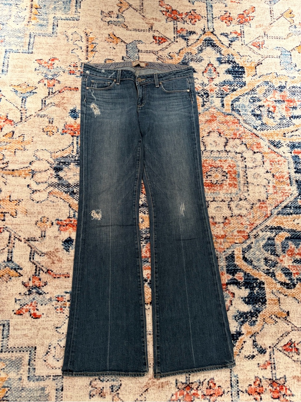 PAIGE Dark Wash Flare Jeans with Subtle Distressing